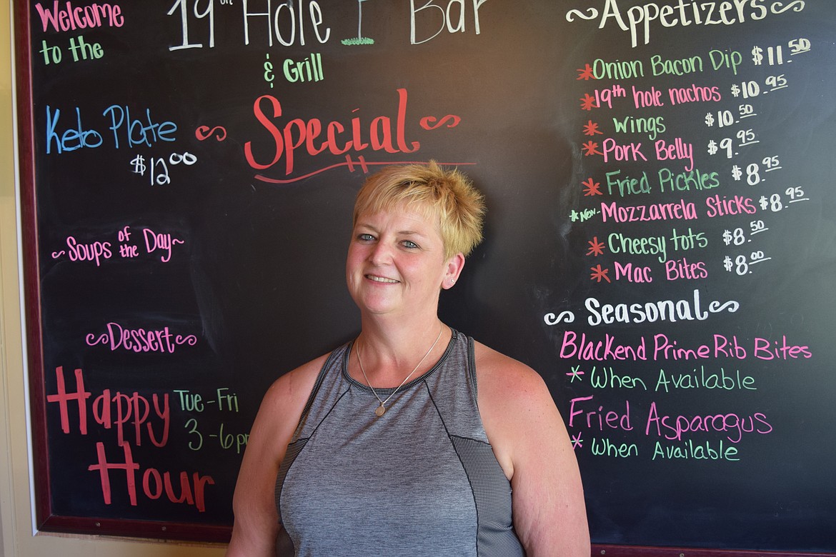 Charles H. Featherstone/Columbia Basin Herald 
 Cindy Collins, who co-owns the 19th Hole Bar & Grill with her husband Daniel at the Sage Hills Country Club not far from Warden. The couple received one of the governor's $10,000 Working Washington Small Business grants.