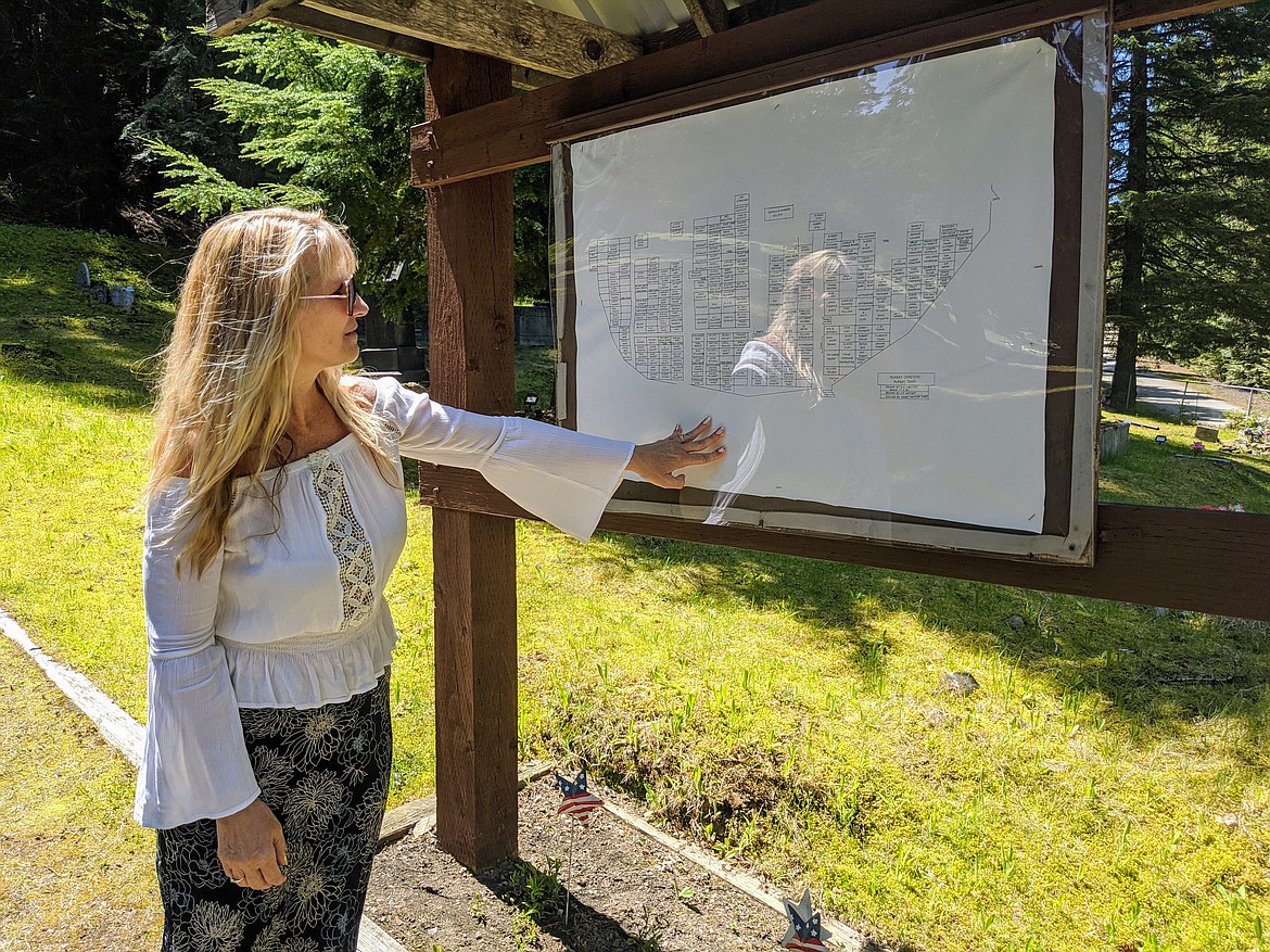 Photo by CHANSE WATSON
Sandy Hammer looks upon the Murray Cemetery map that shows visitors where (mostly) everyone is located on the grounds. Sandy has been instrumental in the cemetery’s rehabilitation efforts and has been responsible for cleaning up, replacing and marking many of the grave markers/headstones.