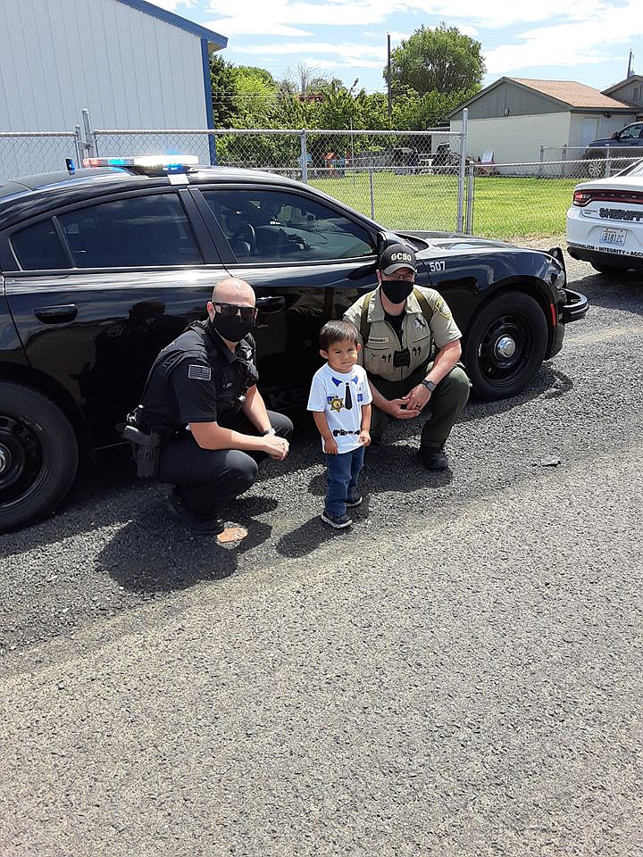 Soap Lake Police Officer Trevor Jones and Grant County Sheriff’s Office Deputy Jason McDonnell stopped by five-year-old Olekzander Lopez’s house to surprise him on his birthday on Sunday afternoon.