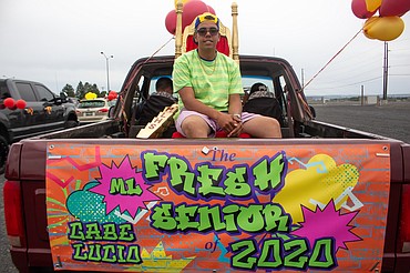 Casey McCarthy/Columbia Basin Herald 
 Moses Lake High School graduate Gabe Lucio wears some "fresh" attire to the school's graduation ceremony on Friday.