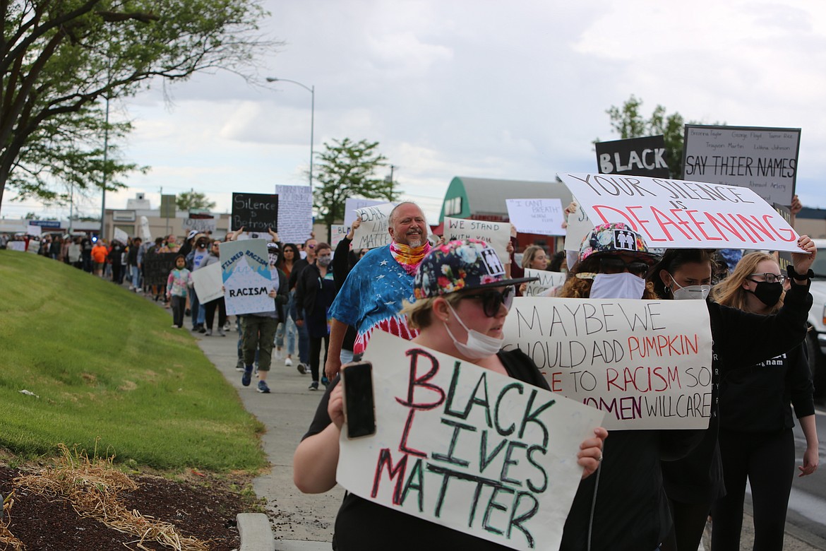 Emry Dinman/Columbia Basin Herald Protesters stretched for the better part of a mile as they marched down South Pioneer Way towards East Wheeler Road.