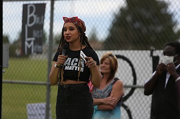 Emry Dinman/Columbia Basin Herald One of six organizers of Sunday's event, 21-year-old Baleigh Sampson, a native of Moses Lake, spoke before the march to thank those who showed up and to reiterate the event's central message about police brutality.
