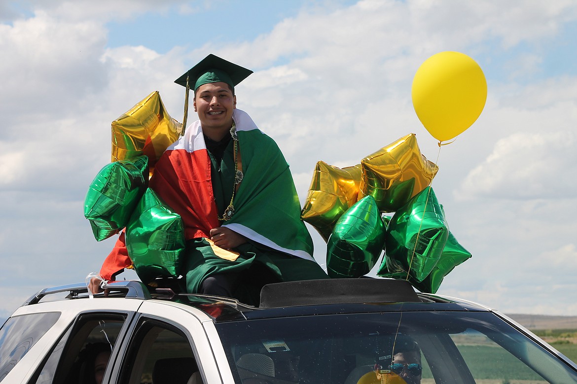 While slowly creeping forward toward their diplomas, many seniors climbed out of their car’s sunroof or lounged on their truck’s flatbed.