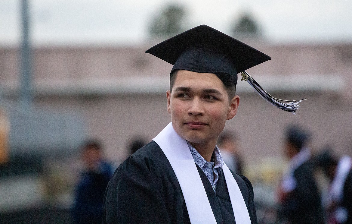 A Royal High School graduate looks back as he makes his way towards the stage on Friday evening.