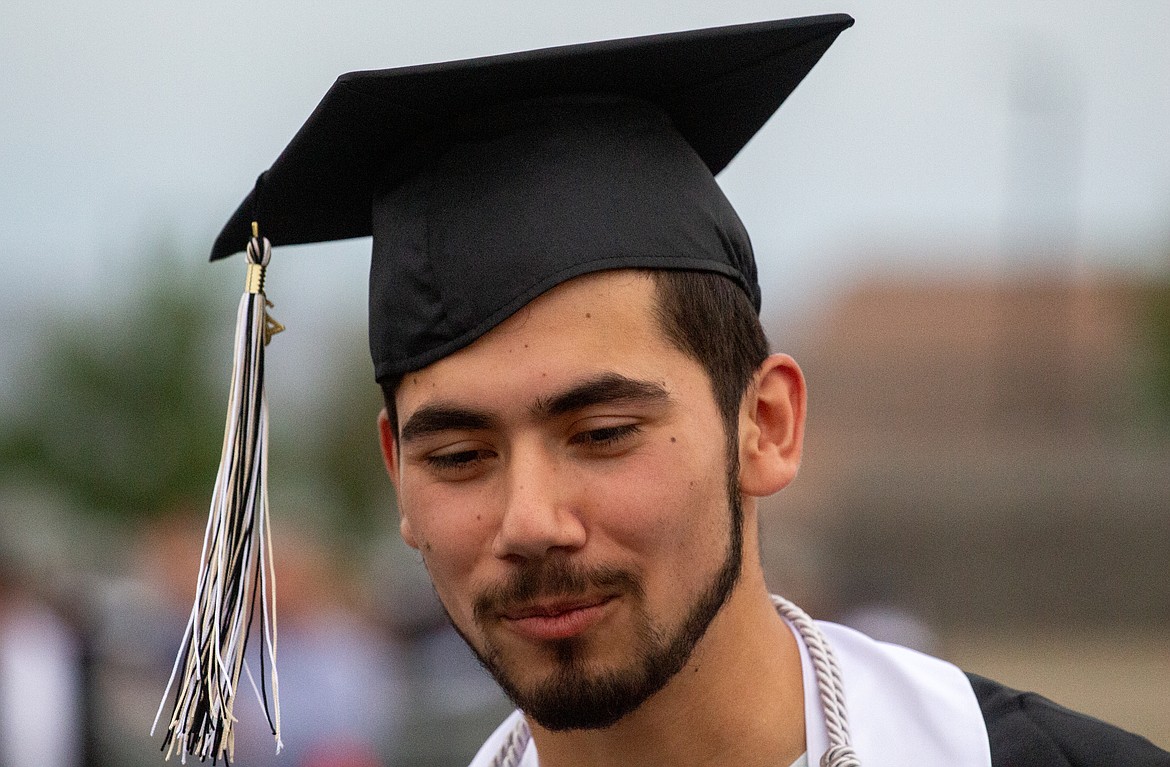 A Royal High School graduate smiles as he makes his way towards the stage to hear his name announced on Friday evening at the school’s graduation ceremony.