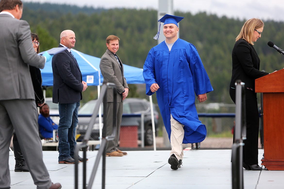 Bigfork High School graduating senior Jack Slawter walks across the stage to accept his diploma.