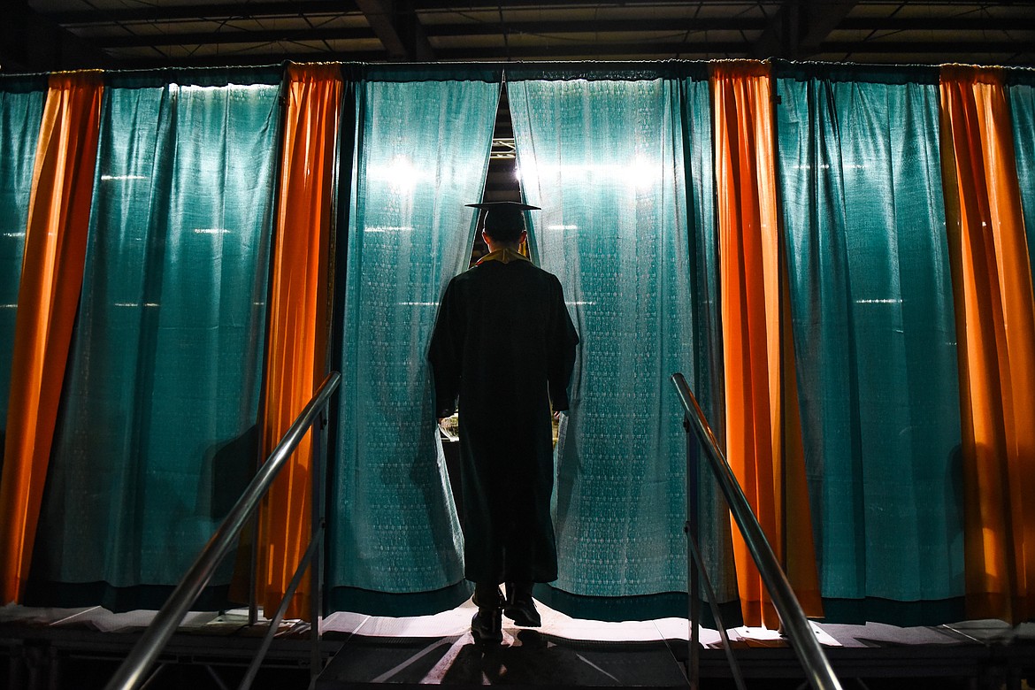 A student prepares to take the stage and receive his diploma during Saturday's Whitefish High School Graduation. (Daniel McKay/Whitefish Pilot)