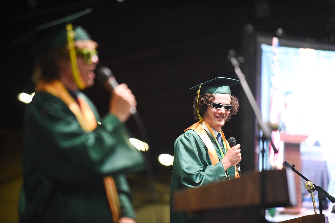 Sam Menicke watches on as Casey Schneider spits bars during the pair's rap at Saturday's Whitefish High School Graduation. (Daniel McKay/Whitefish Pilot)