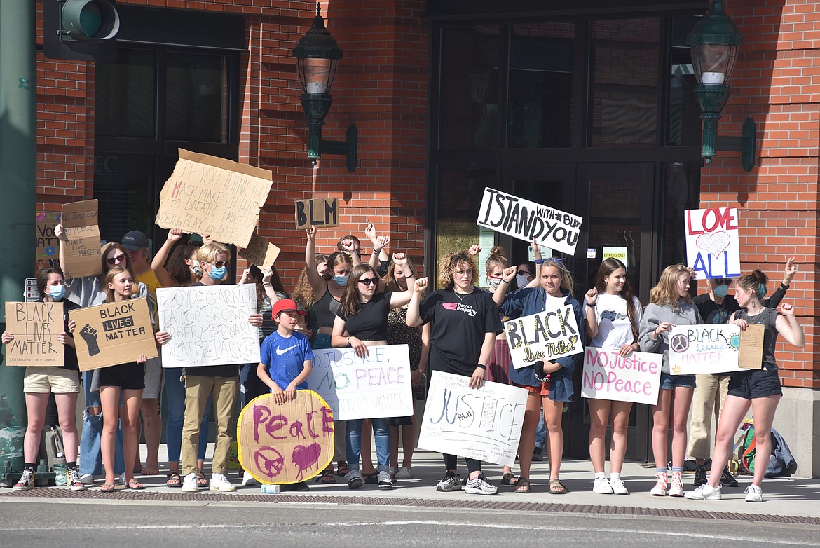 A group of demonstrators gather in front of Whitefish City Hall Wednesday evening protesting the recent death of George Floyd and showing support for the Black Lives Matter movement. Demonstrators stood at both the Baker Avenue and Second Street and the Second and Spokane Avenue intersections. The protestors have been gathering every evening for a few hours in downtown holding up signs and chanting. At times about 100 people were assembled. (Heidi Desch/Whitefish Pilot)