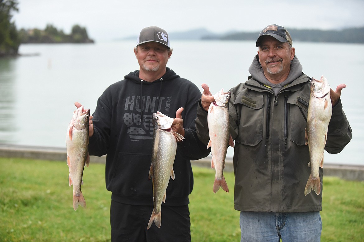 KALISPELL ANGLERS Larry Ludahl, left, and Shane Stratton show off their catch of lake trout Saturday, June 6 at the boat launch in Somers. Both men are competing in the Mack Days Tournament, designed to reduce numbers of the fish in Flathead Lake. Ludahl caught 36 lakers while Stratton boated 35. One of Stratton’s fish went back into the water since it was a slot fish, measuring 32 inches. (Scott Shindledecker/Daily Inter Lake)