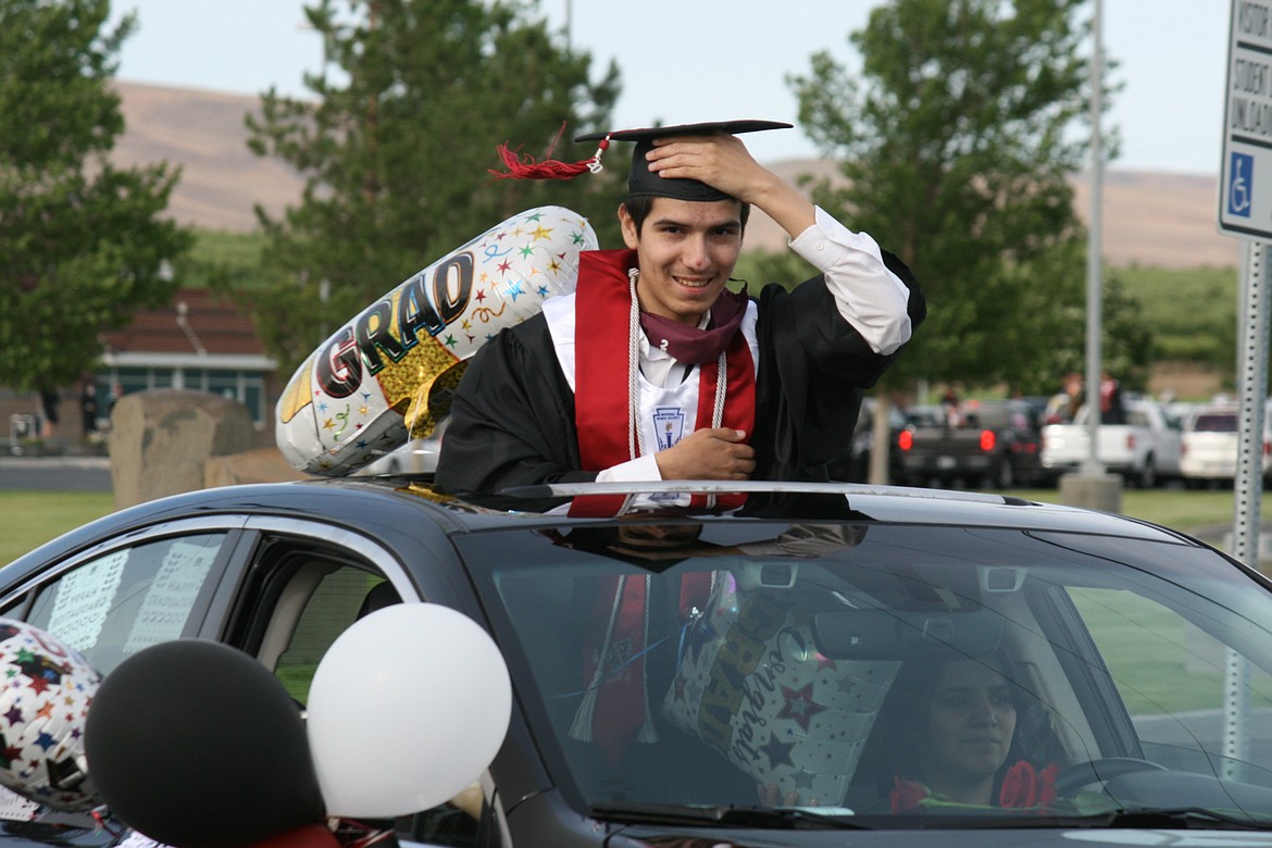 The Wahluke High School class of 2020 celebrated graduation in a unique fashion, with a car parade through Mattawa and extra precautions when they picked up their diplomas.