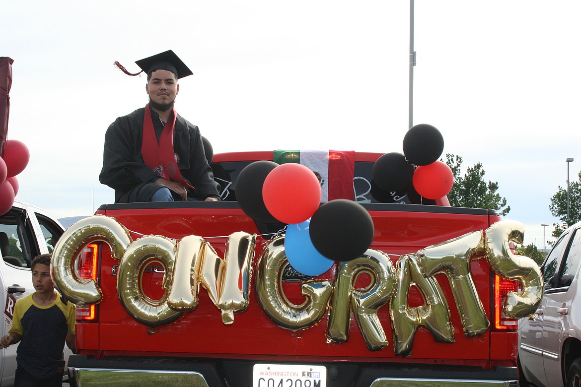Cheryl Schweizer/Columbia Basin Herald 
 The Wahluke High School class of 2020 celebrated graduation in a unique fashion, with a car parade through Mattawa and extra precautions when they picked up their diplomas.