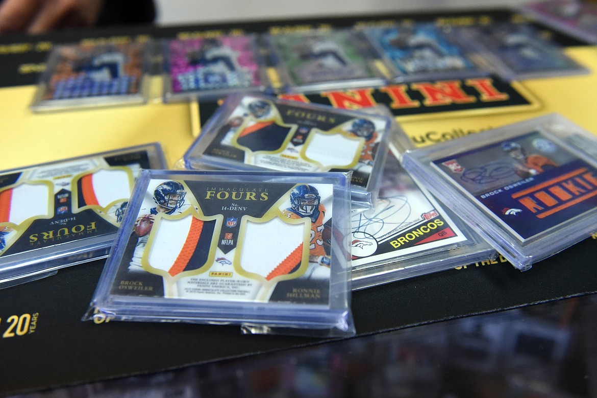 An Immaculate Fours card at Sports Cards Plus containing a small piece of jersey of four former Denver Broncos football players: Brock Osweiler, Ronnie Hillman, Cody Latimer and Emmanuel Sanders. (Casey Kreider/Daily Inter Lake)