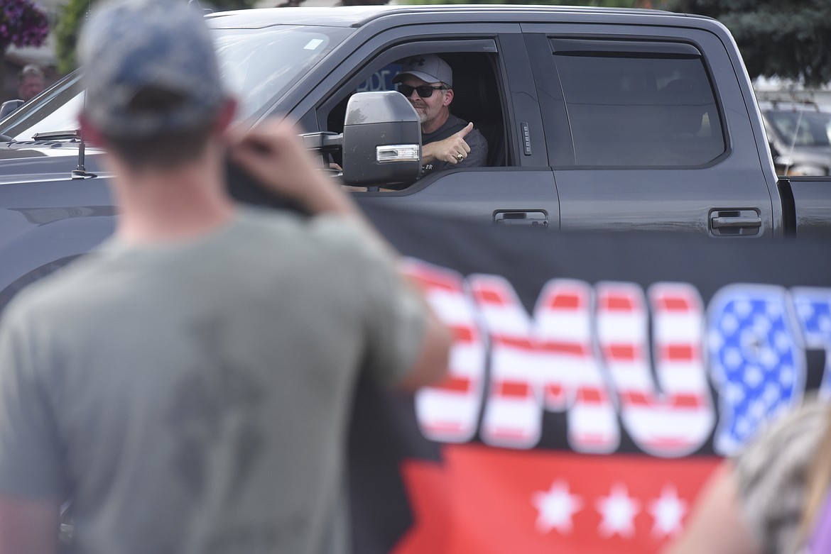 Supporters of President Donald Trump wielded banners and a variety of firearms across the street from the Black Lives Matter demonstration. (Derrick Perkins/The Western News)