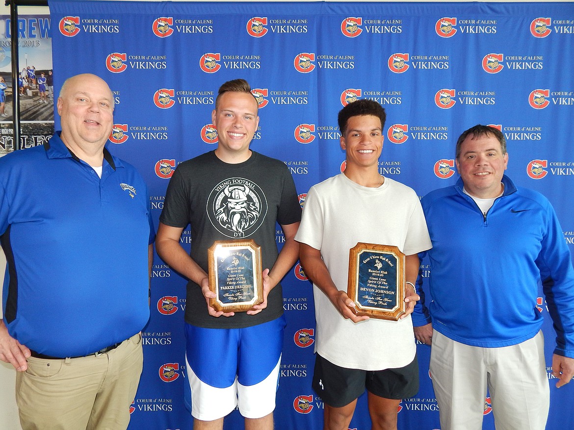 Parker Drechsel, second from left, and Devon Johnson were recently named winners of the Ginny Lenz Spirit of the Viking Award by the Coeur d’Alene High School Viking Booster Club. At left is Rick Rasmussen, booster club president; and at right is Mike Bloom, booster club treasurer.