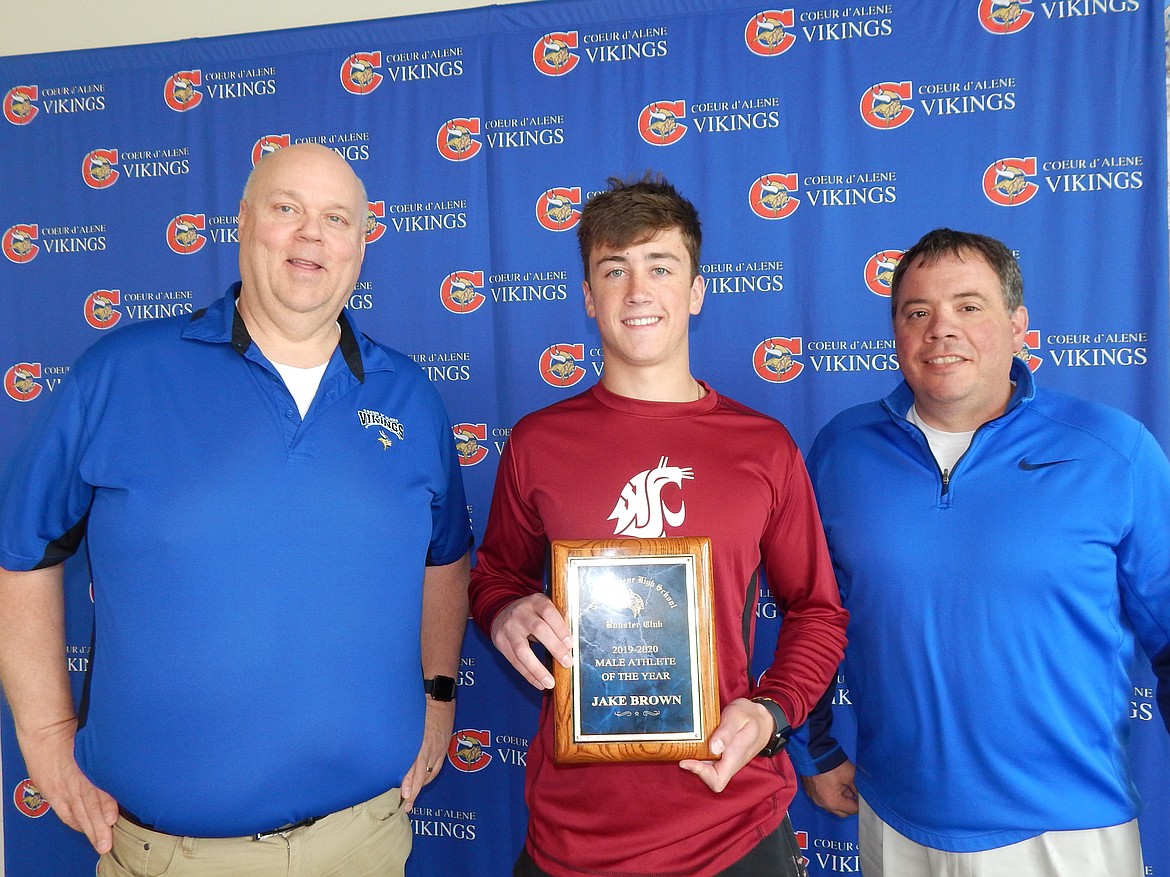Jake Brown was recently named Coeur d’Alene High School Viking Booster Club Male Athlete of the Year. Pictured at left is Rick Rasmussen, booster club president; and at right is Mike Bloom, booster club treasurer.