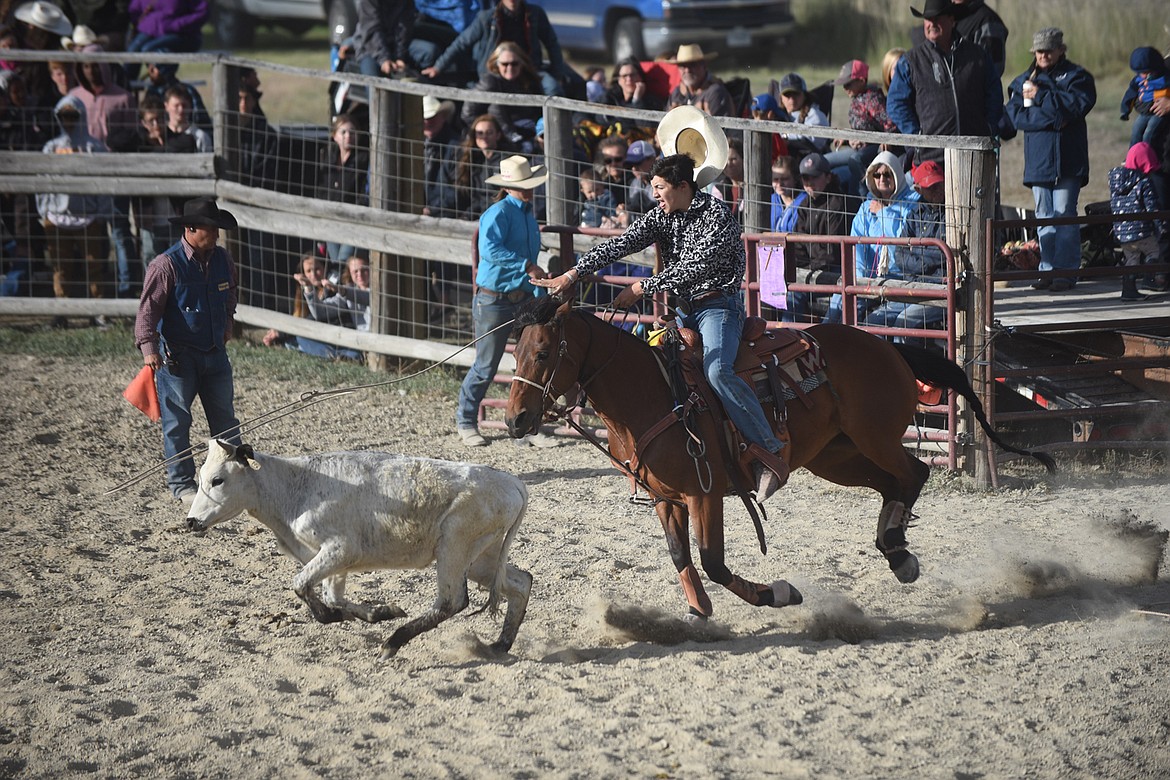 Ethan Marceu lassoes a calf during the mens breakaway at the Hot Springs Rodeo June 13. (Scott Shindledecker/Valley Press)