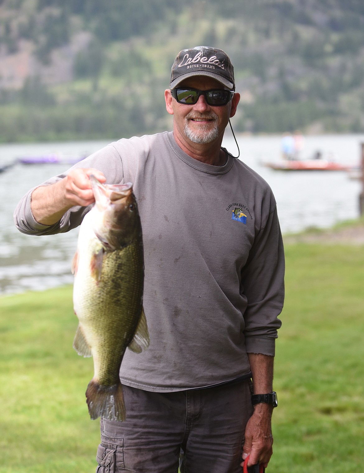 Trout Creek's Jim Conlin shows off a 6.22-pound largemouth bass he caught June 12 in the Montana BASS Nation tournament held at Noxon Reservoir last weekend. Conlin won the three-day tournament with a total of 45.39 days. (Scott Shindledecker/Valley Press)