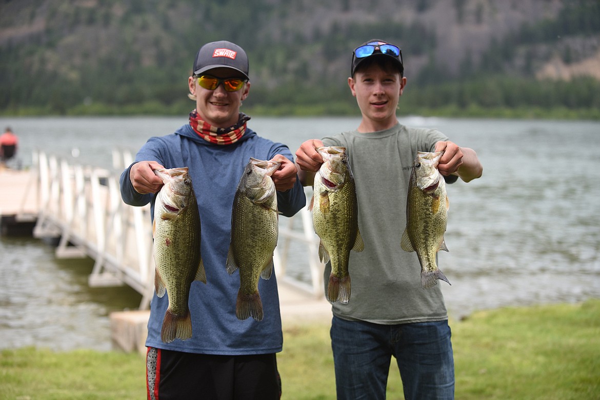 Noxon residents Austin Johnson, left, and Ethan Kruger, show off their catches from last Friday's fishing at Noxon Reservoir during the Montana BASS Nation State Championship. Johnson finished first in the non-boater group with 26.29 pounds. Kruger totaled 11.02 pounds. (Scott Shindledecker/Valley Press)