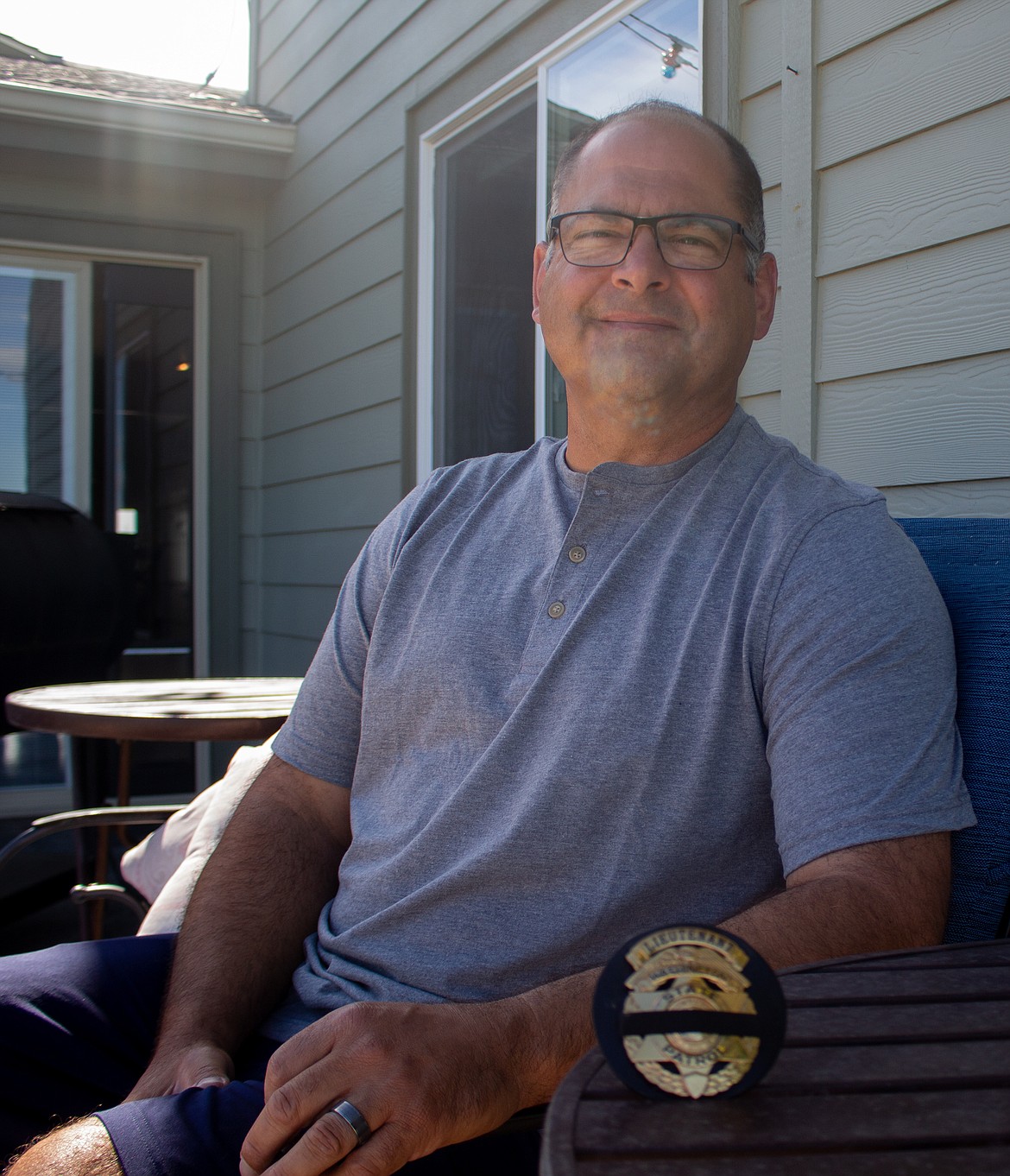 Kurt Adkinson pauses for a moment after finishing up a 25-year career with the Washington State Patrol last Friday.