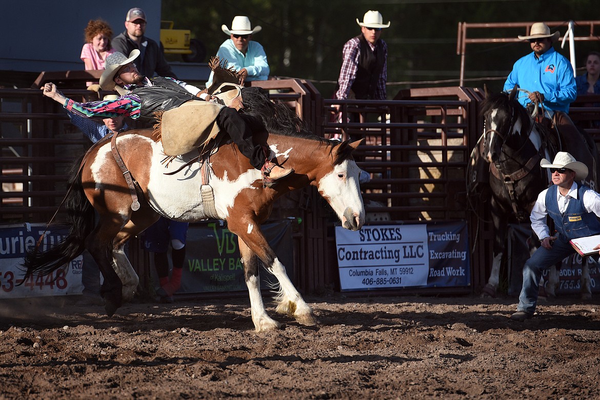 Dustin Morigeau comes out of the gate during ranch bronc riding.