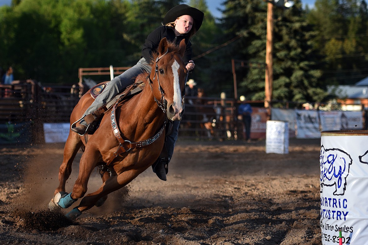 Zoey Bruyer heads for the final turn in peewee barrel racing. (Jeremy Weber/Daily Inter Lake)