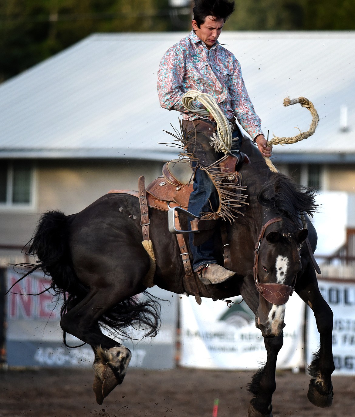 Devyn Campbell holds on during the ranch bronc riding at the Brash Rodeo Summer Series.