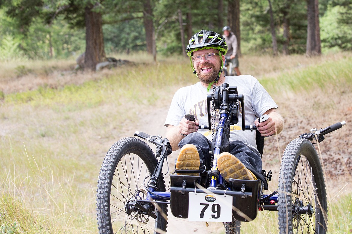 Bryce Fauskee rides an adaptive hand cycle in the 12 and 24 Hours of Flathead mountain bike race last year. DREAM Adaptive Recreation started its new mountain bike program in the summer of 2019. (Photo provided by DREAM Adaptive Recreation)