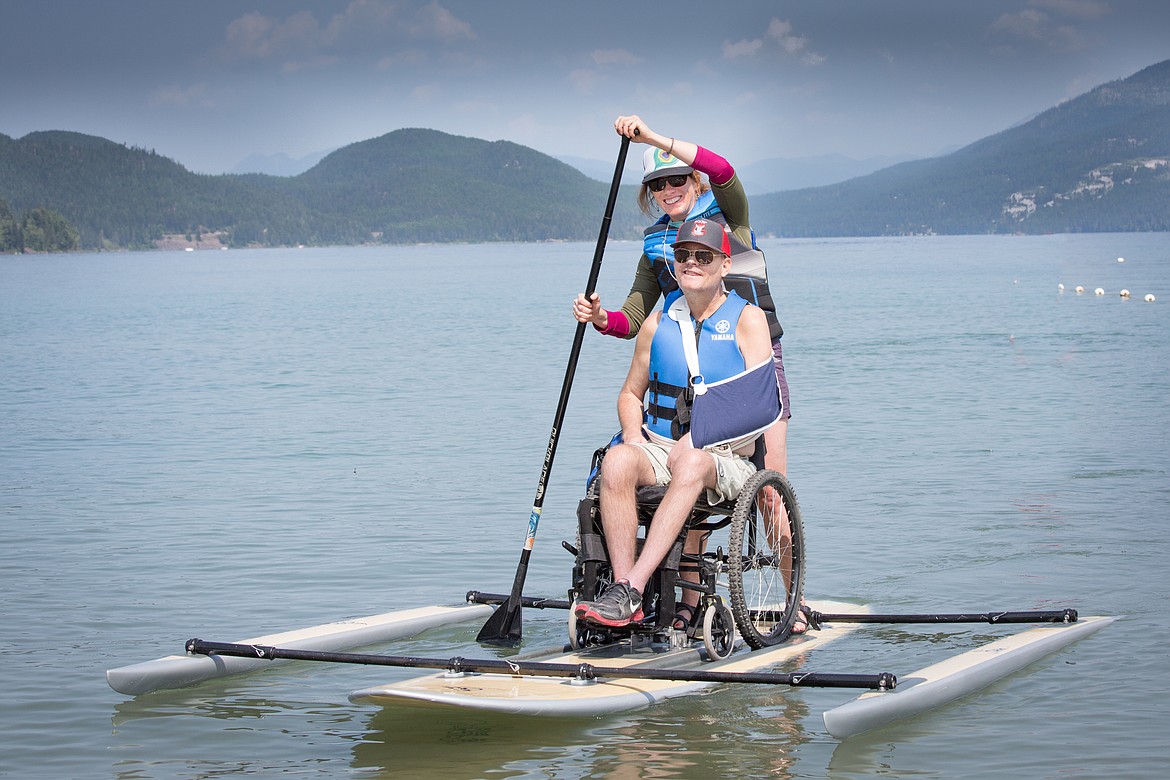 Kim Weichers and Alan Elm enjoy a sunny July day on an adaptive paddle board. (Photo provided by DREAM Adaptive Recreation)
