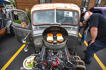 Decorative cheeseburgers sit atop a barbecue grill over the air cleaner on Greg and Tana Greene's 1939 Chevy Rat Rod at The Big Shindig car show hosted by The Glacier Street Rod Association and The Desoto Grill in Kalispell on Saturday, June 20. (Casey Kreider/Daily Inter Lake)