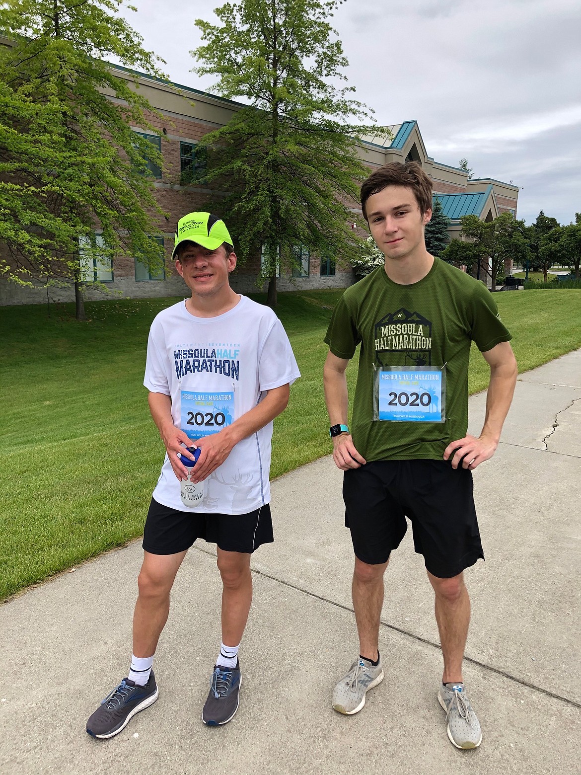 Jim Kinnard, left, and running buddy Carter Gordon at Lake City High on Saturday after finishing a “virtual” Missoula half-marathon.