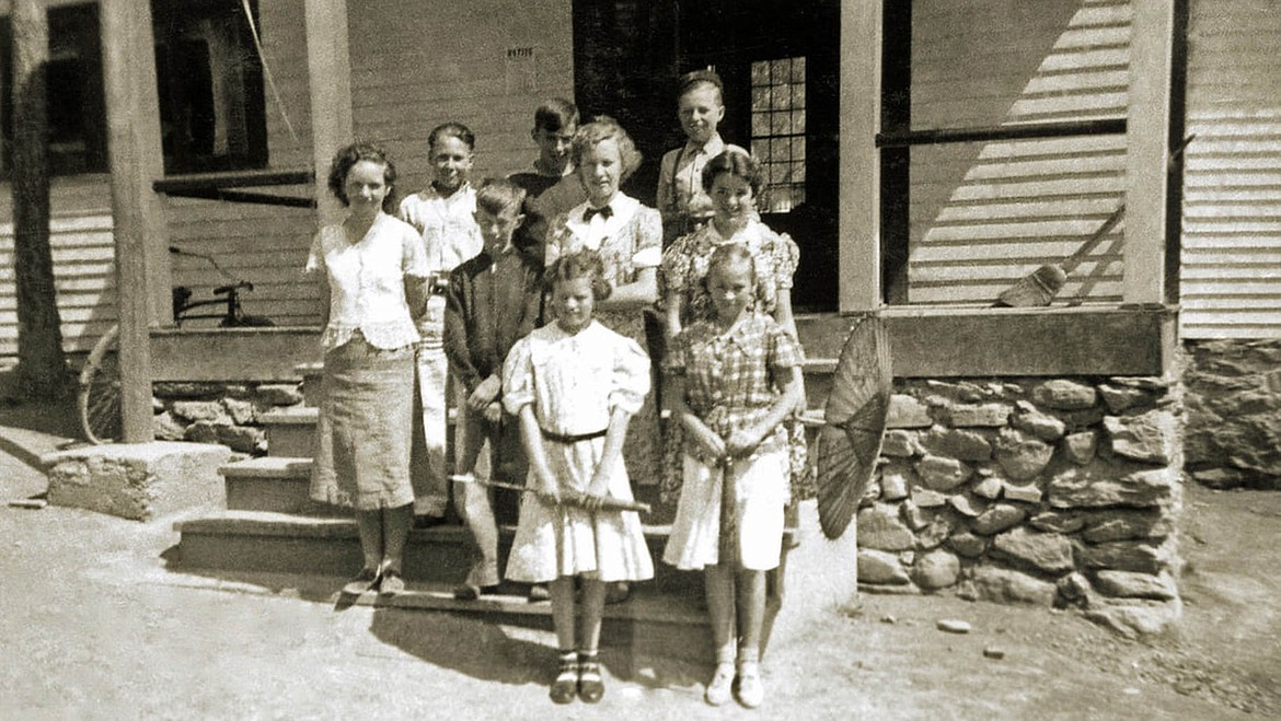 Helen Turner (center) poses with the rest of the eighth grade graduates in front of Lakeside School. (Courtesy of Turner Treks and Tales / www.turnertreks.net)