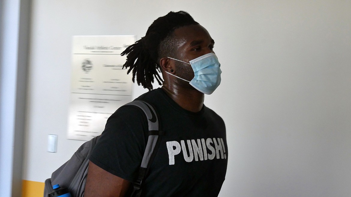 Charles Akanno, a fifth-year senior linebacker from Inglewood, Calif., heads to a workout.