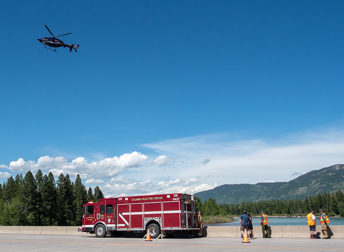 Two Bear Air and Columbia Falls firefighter search for an individual that was reported in the Flathead River Tuesday afternoon. The person apparently went in the water near the former Columbia Falls Aluminum Plant. The search was ongoing. (Chris Peterson photo)