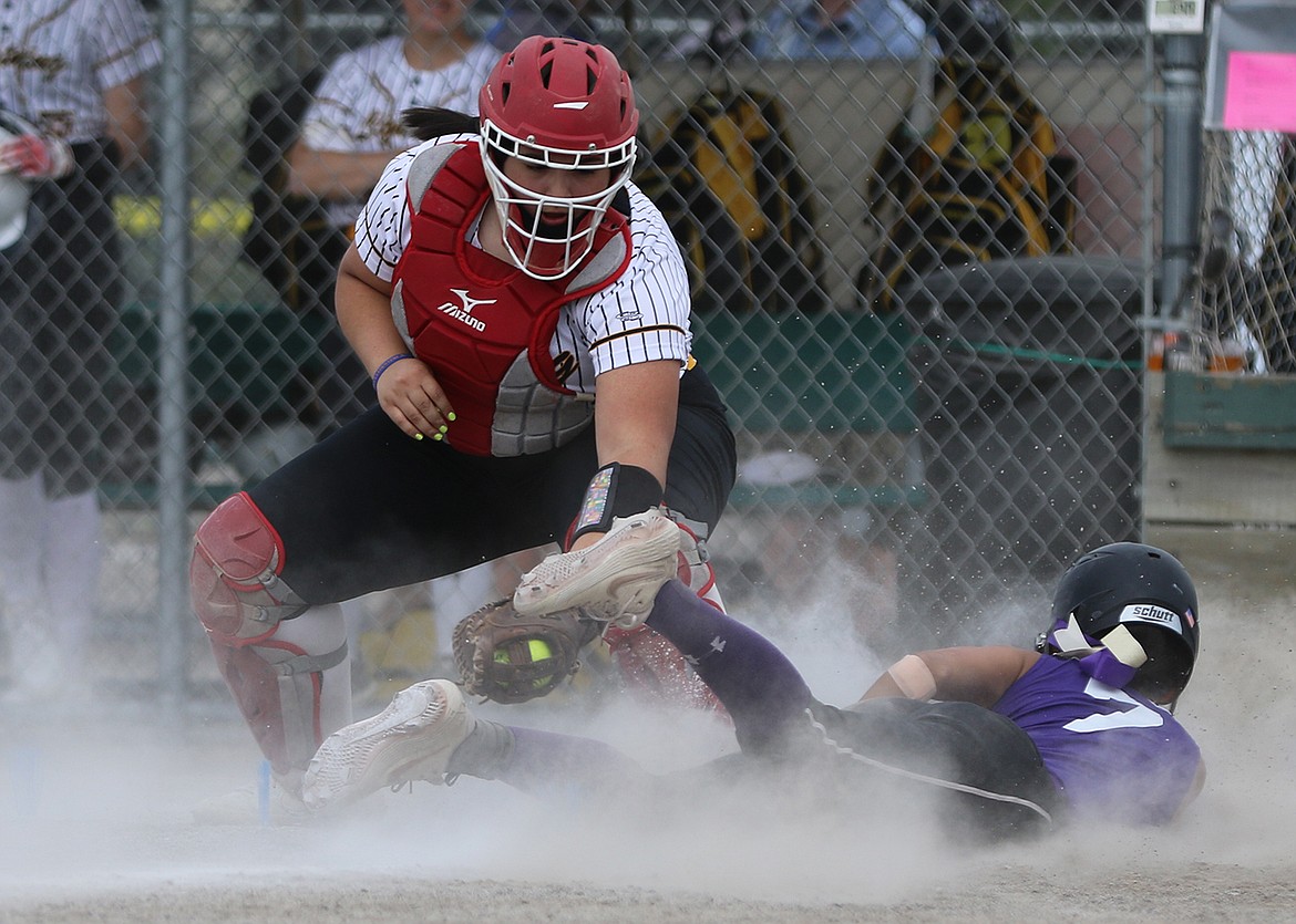 16U Polson Lady Pirate Josie Caye slides home safe during a game at the 2020 Emeralds Smash softball tournament in Kalispell June 26-28. (Bob Gunderson photo)