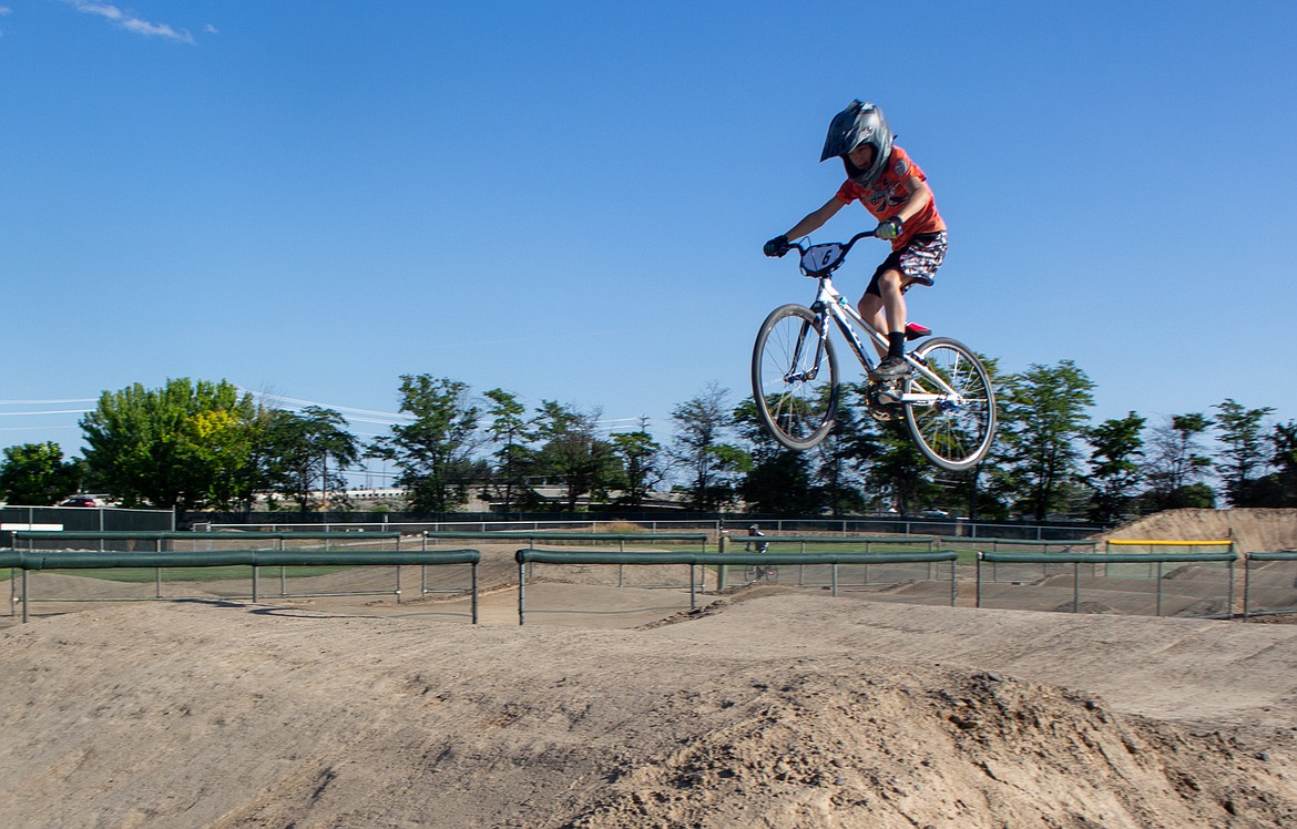 Rhett Smith, USA BMX member, soars over the dirt at Larson Recreation Center Track on Thursday afternoon.