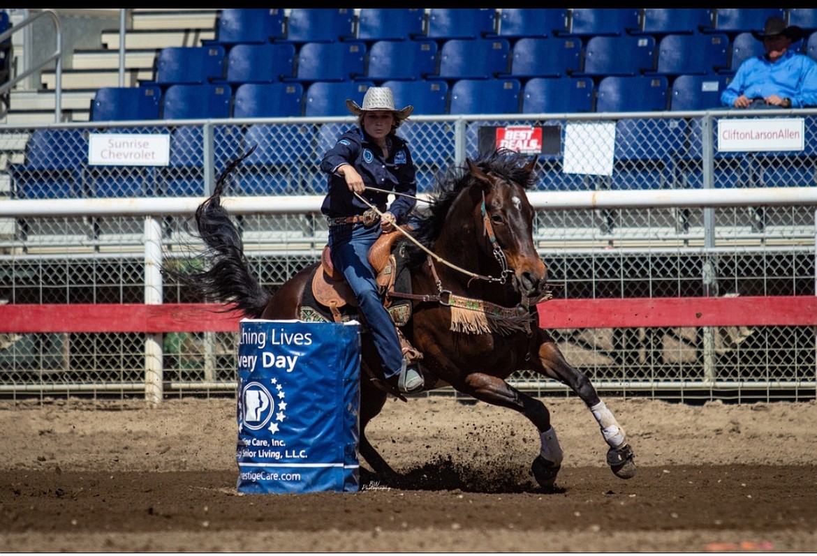 Aubree Skone takes part in the high-school barrel racing rodeo event last year in Omak, Washington, on her horse, Six.