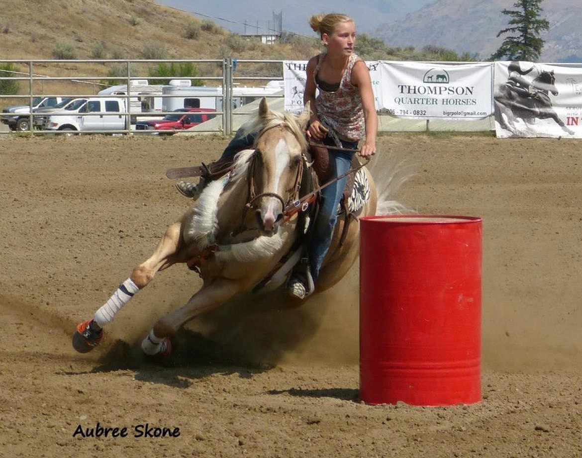 At 11 years old, Aubree Skone had just begun barrel racing. Here she rounds the turn on her horse, Yellow.