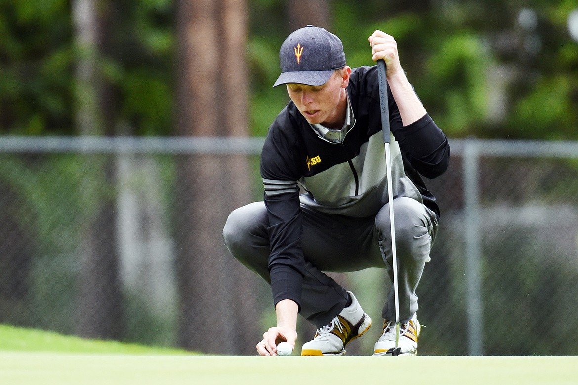 Ryggs Johnston lines up a putt on the 11th green of the North Course during the Earl Hunt 4th of July Tournament at Whitefish Lake Golf Club on Thursday, July 2. (Casey Kreider/Daily Inter Lake)