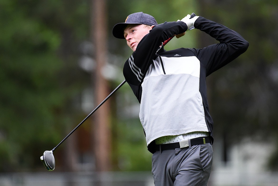 Ryggs Johnston watches his drive off the 12th tee of the North Course during the Earl Hunt 4th of July Tournament at Whitefish Lake Golf Club on Thursday. (Casey Kreider/Daily Inter Lake)
