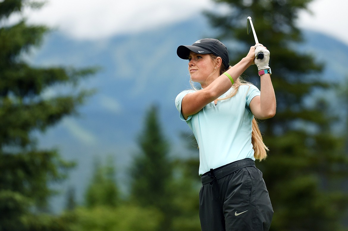 Teigan Avery watches her shot off the 5th tee of the South Course during the Earl Hunt 4th of July Tournament at Whitefish Lake Golf Club on Thursday. (Casey Kreider/Daily Inter Lake)