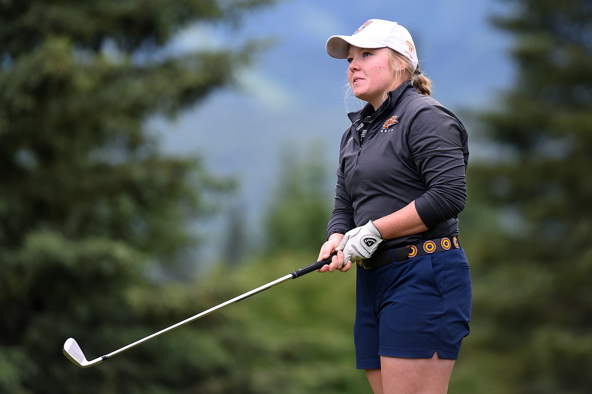 Marcella Mercer watches her shot off the 5th tee of the South Course  during the Earl Hunt 4th of July Tournament at Whitefish Lake Golf Club on Thursday. (Casey Kreider/Daily Inter Lake)