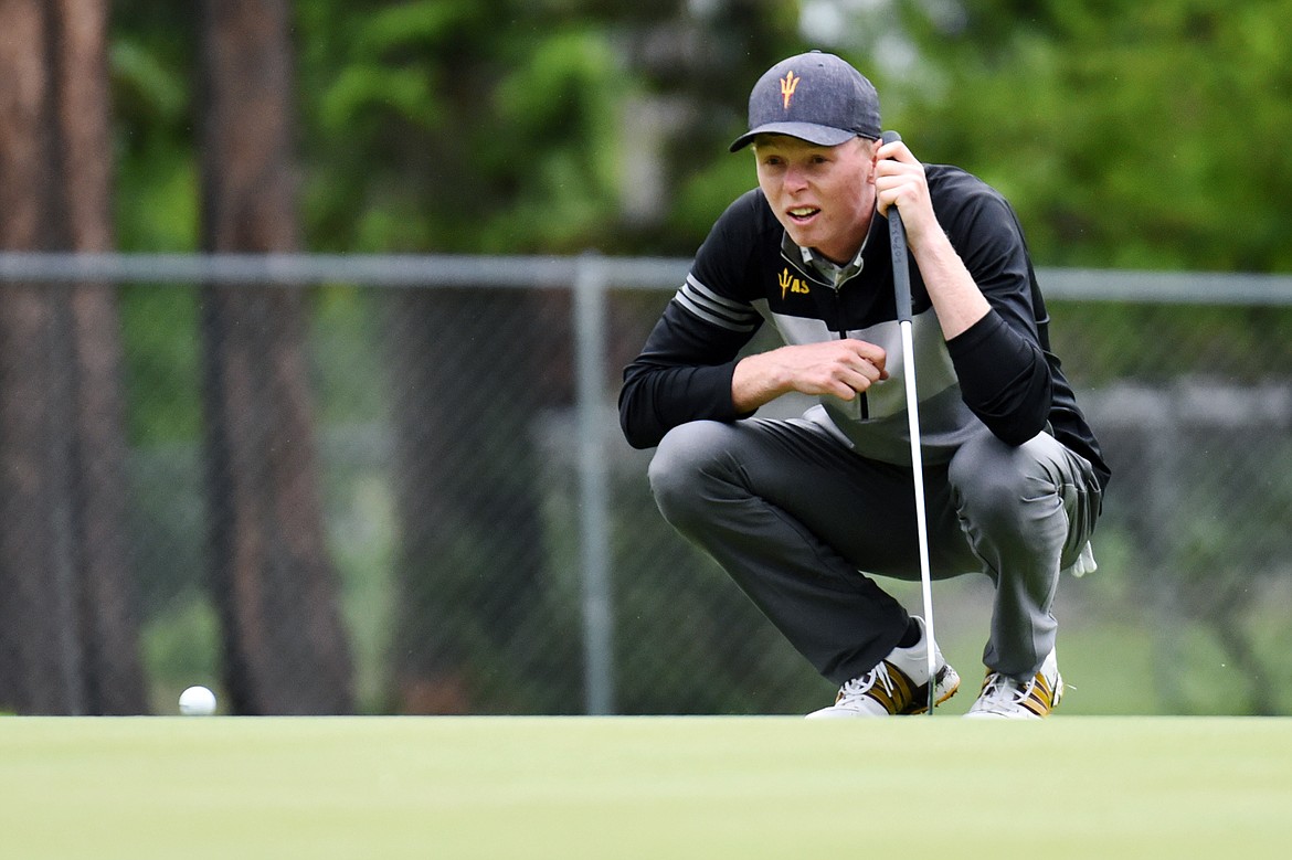 Ryggs Johnston lines up a putt on the 11th green of the North Course during the Earl Hunt 4th of July Tournament at Whitefish Lake Golf Club on Thursday, July 2. (Casey Kreider/Daily Inter Lake)