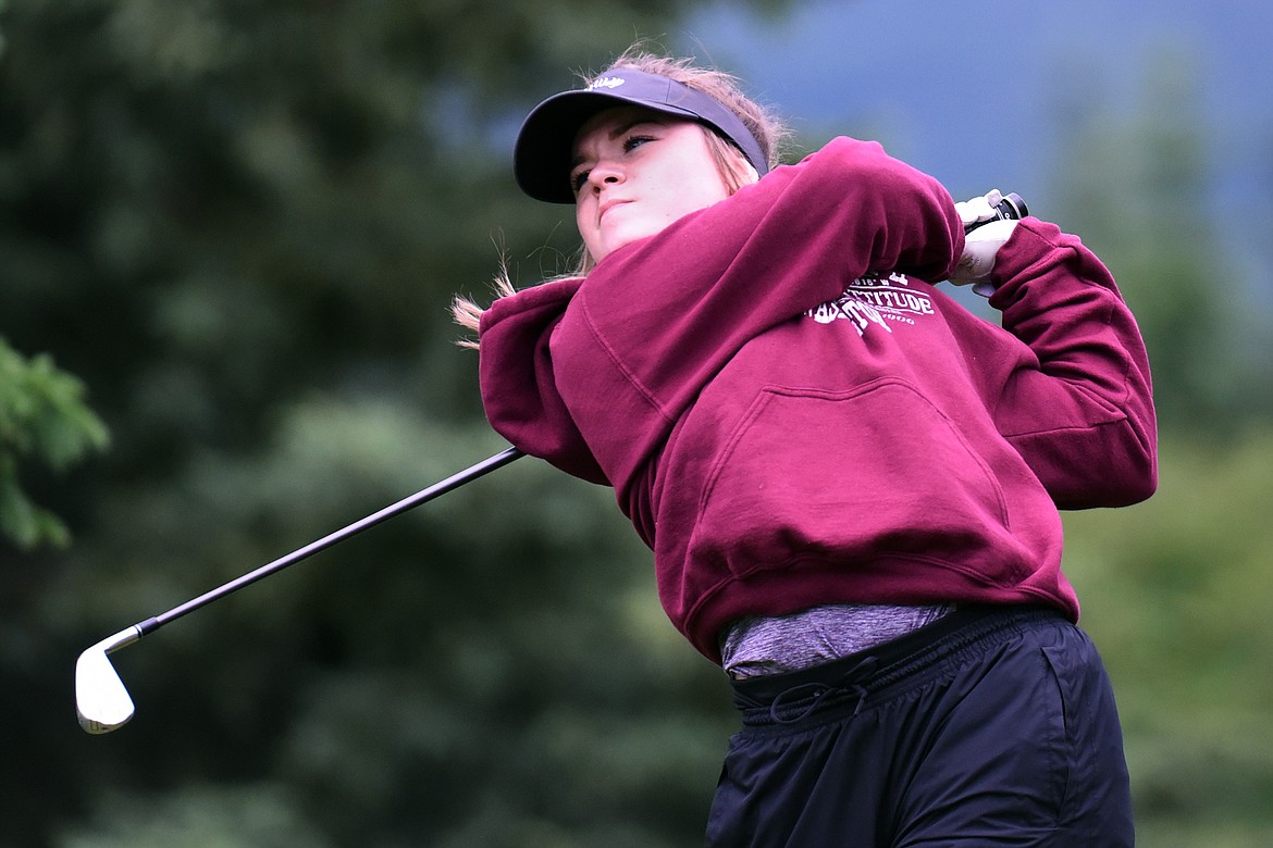 Alana Griffin watches her shot off the 5th tee of the South Course during the Earl Hunt 4th of July Tournament at Whitefish Lake Golf Club on Thursday, July 2. (Casey Kreider/Daily Inter Lake)