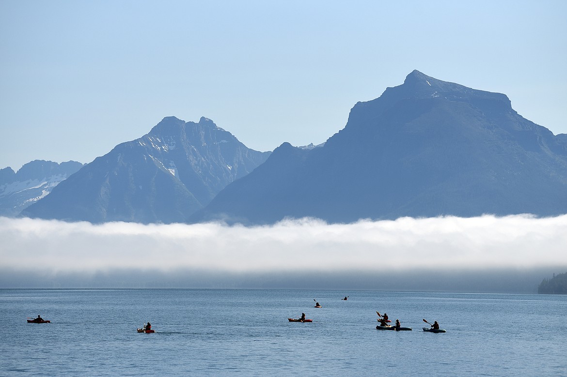 Kayakers paddle around Lake McDonald in Glacier National Park on Friday, July 3. (Casey Kreider/Daily Inter Lake)
