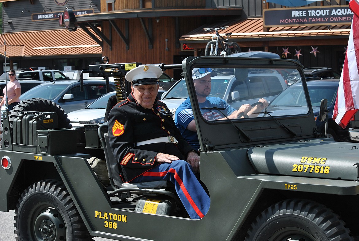 St. Regis veteran John Cochran rides along in a U.S. Marine Corp Jeep in the parade on Saturday. (Amy Quinlivan/Mineral Independent)