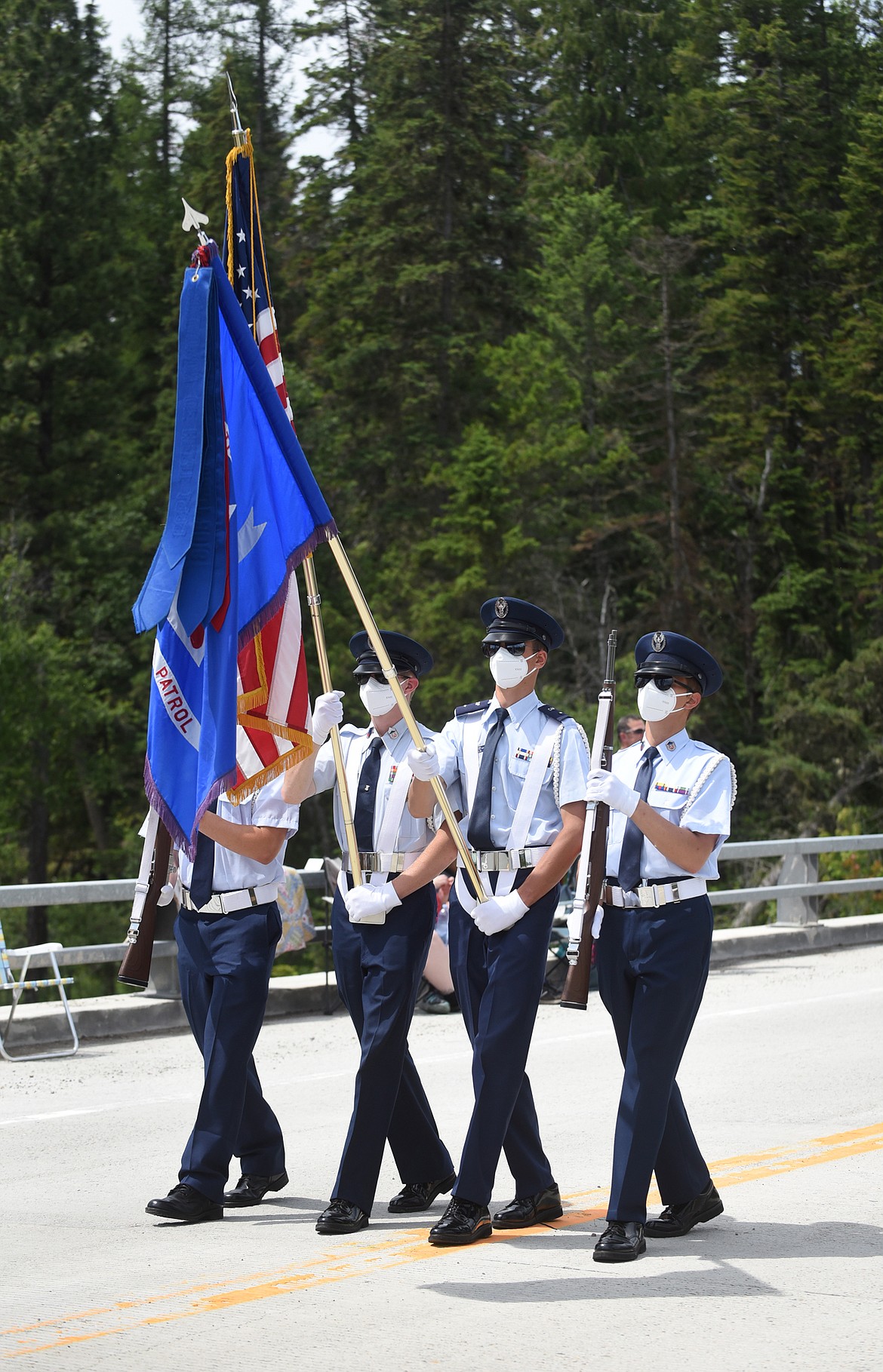 Members of the Civil Air Patrol Color Guard parade down Montana 209 in Ferndale.
