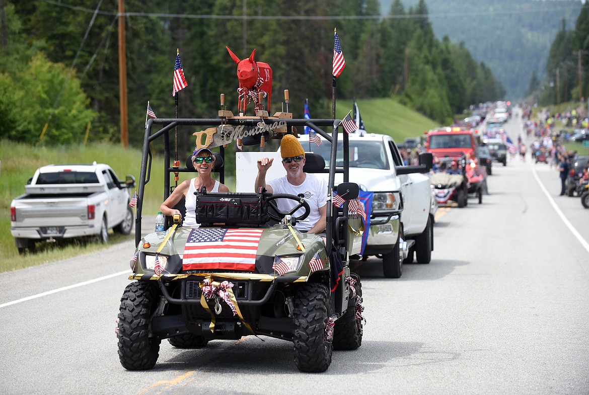 Dozens of vehicles and floats drive down Montana 209 during the Bigfork Fourth of July Parade.