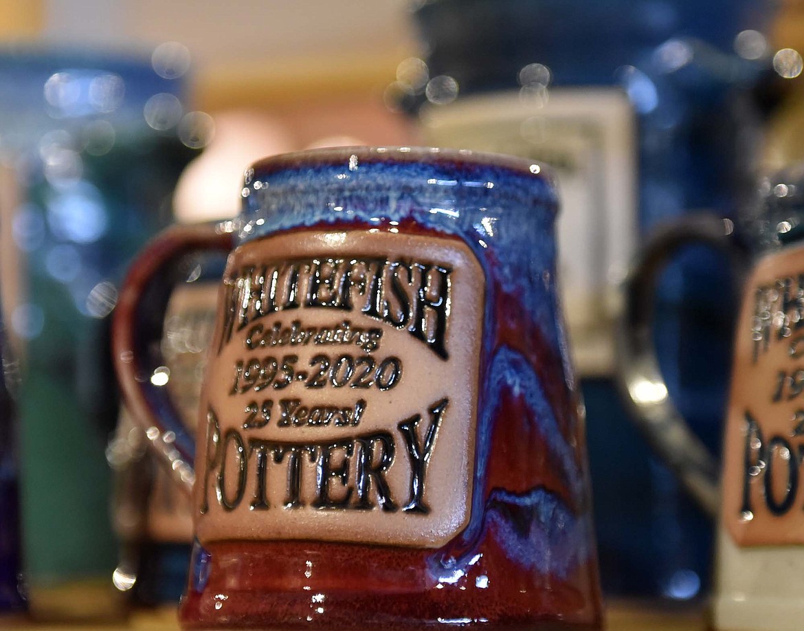 A shelf of Whitefish Pottery mugs celebrate the business’ 25th anniversary. (Heidi Desch/Whitefish Pottery)