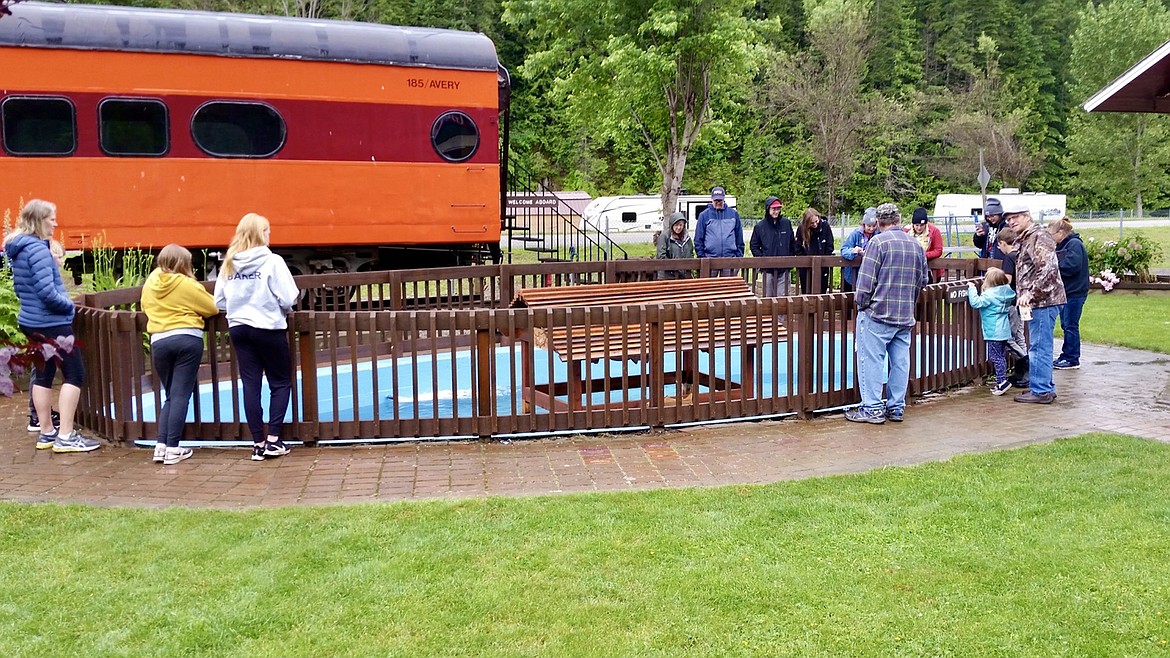 Photo by AVERY IDAHO, ST. JOE RIVER FACEBOOK PAGE/ Residents check out the new fish in the pond.